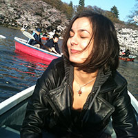 me on a boat surrounded by cherry blossom