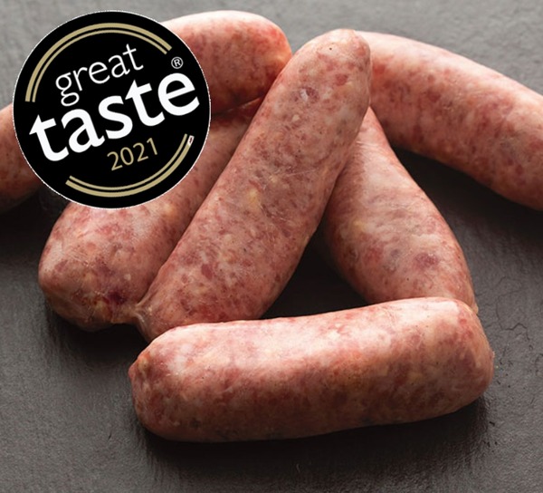 Chilli sausages on slate background with round black and gold Great Taste 2021 logo